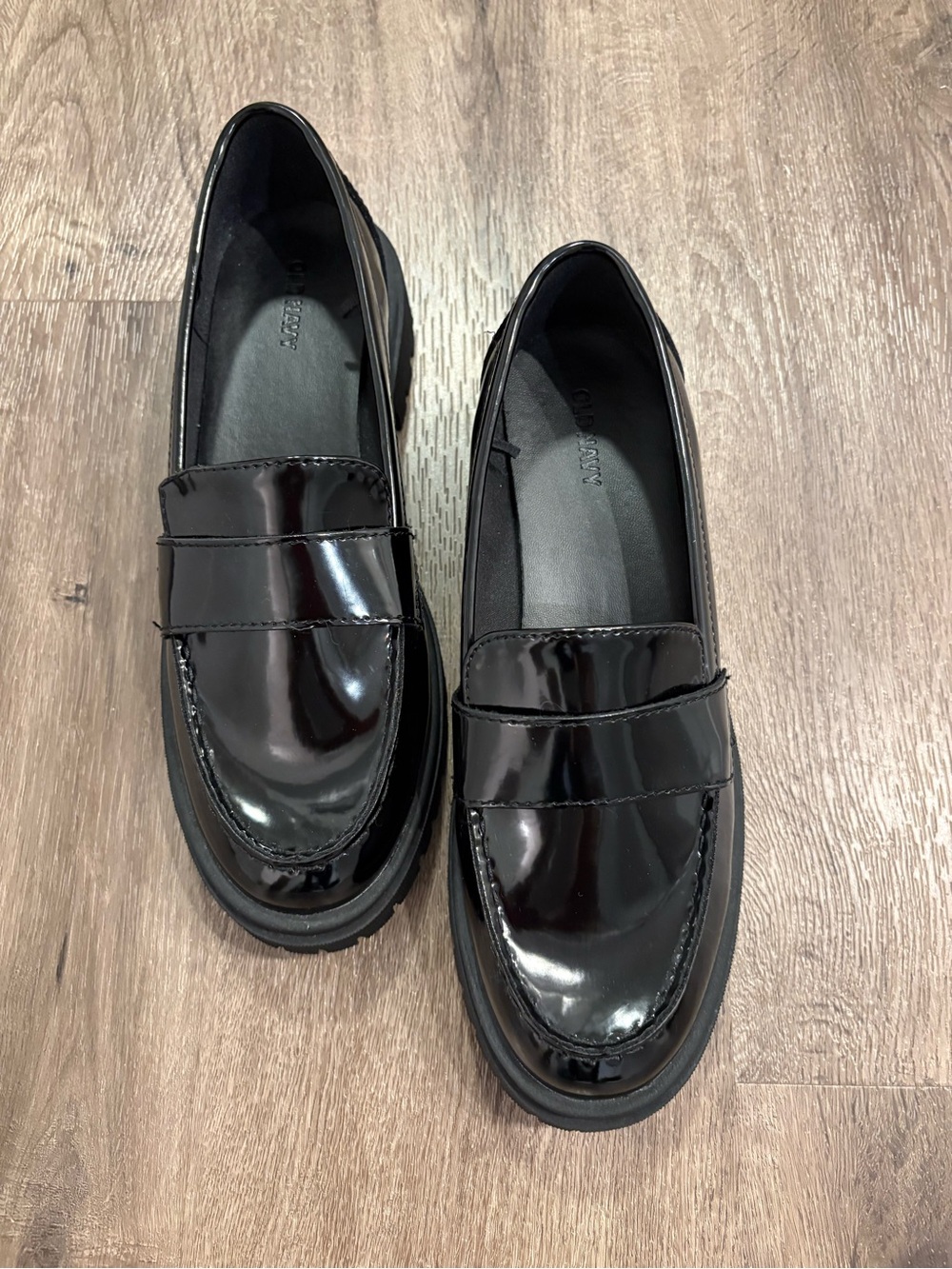 Women’s Black Patent Leather Penny Loafers.
